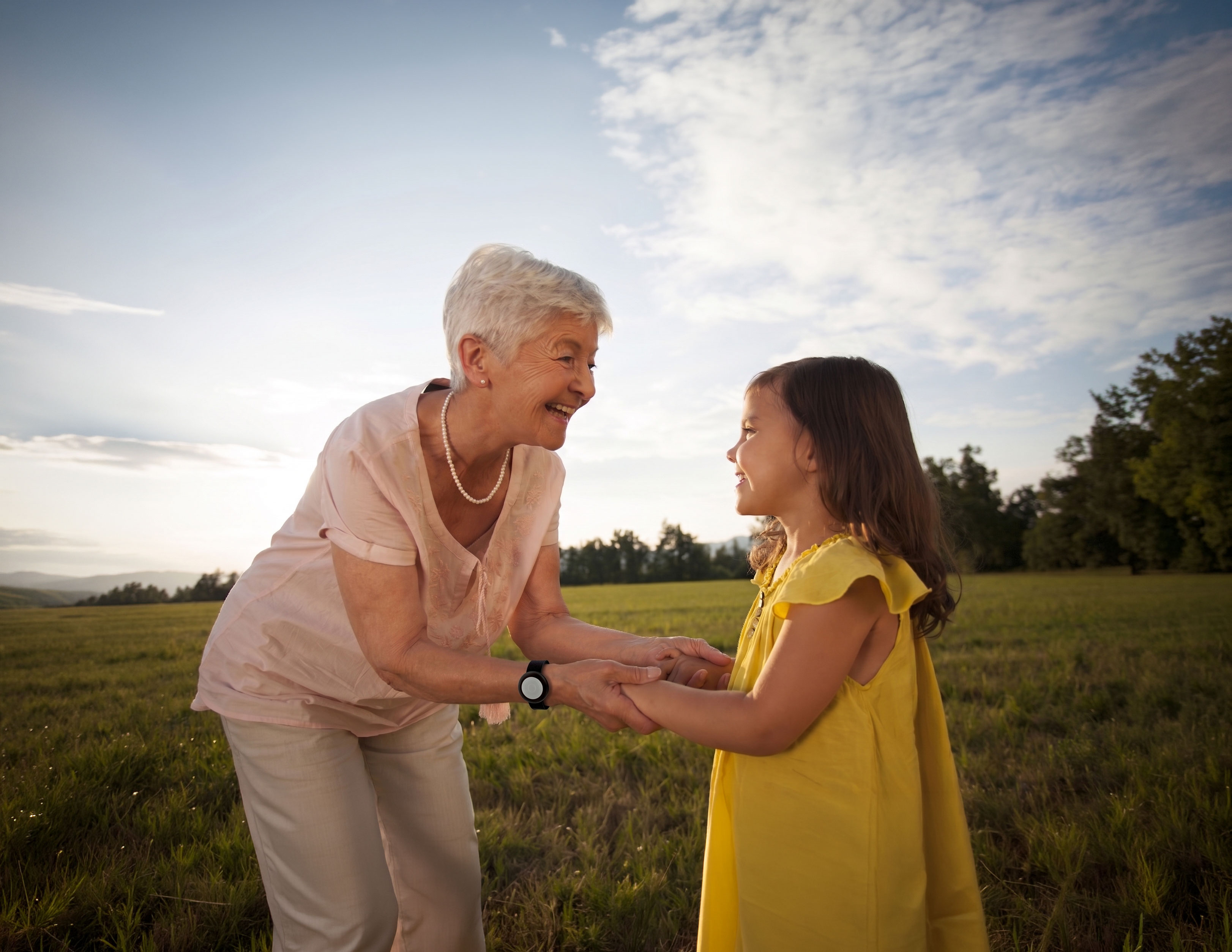 Senior couple smiling, holding each other